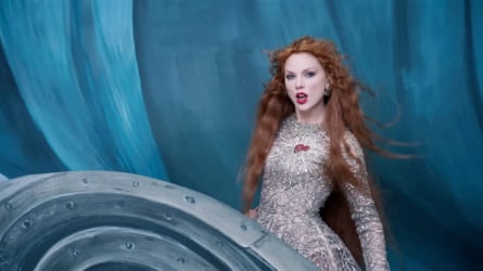Taylor Swift wearing the silver long sleeved gown designed by Adelaide couturier Paolo Sebastian in her the Fate of Ophelia video.