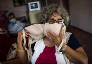 Idania Espanola, 63, adapts a bra to wear as a mask in Cojímar, east of Havana