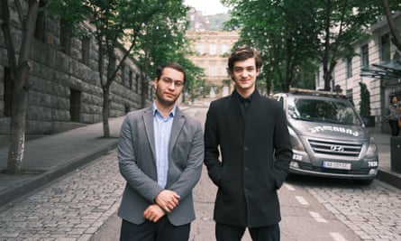 Zviad Tsetskhladze (left) and Luka Natsvlishvili standing in the centre of a tree-lined street