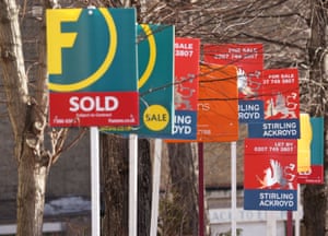 Estate agents’ For Sale signs.
