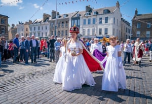 Susannah Ayling, 12, plays the Queen in a re-enactment of the coronation performed by members of the local Cubs, Scouts and Guides in Kelso town square