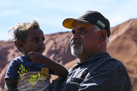 Sammy Wilson, chairman of the Central Land Council, with his grandson Jacob at Uluru-Kata Tjuta national park.
