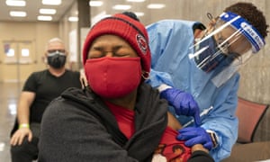 Jorie Winbish, 56, of Washington, receives her second dose of the Covid-19 vaccine at a clinic at Howard University in Washington. ‘I feel so lucky to have number two in my arm,’ says Winbish.