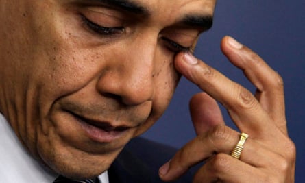 Barack Obama wipes a tear as he speaks about the shooting at Sandy Hook elementary school.