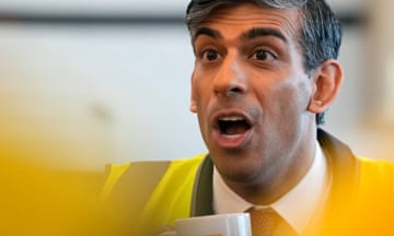 Rishi Sunak speaks to employees during a visit to the DHL Gateway port facility at Stanford Le Hope on the Thames estuary east of London on April 29, 2024.