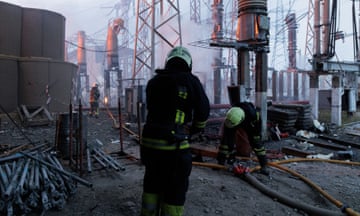 Firefighters tackle a blaze at an electricity facility in Kharkiv after a Russian attack on 22 March.