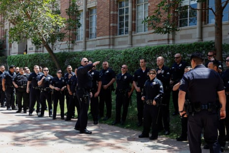 Law enforcement officers gather near the encampment of pro-Palestinian protesters on the campus of University of California Los Angeles (UCLA).