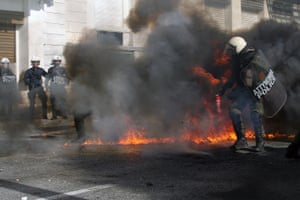 GREECE-ATHENS-PROTEST-AUSTERITY MEASURES<br>12 Nov 2015, Athens, Attica, Greece --- (151112) -- ATHENS, Nov. 12, 2015 (Xinhua) -- Greek riot police clash with protesters in central Athens, Greece, Nov. 12, 2015. Greece was hit on Thursday by a 24-hour nationwide general strike called by trade unions protesting the new round of austerity measures imposed to redress a six-year debt crisis. (Xinhua/Marios Lolos) --- Image by © Marios Lolos/Xinhua Press/Corbis