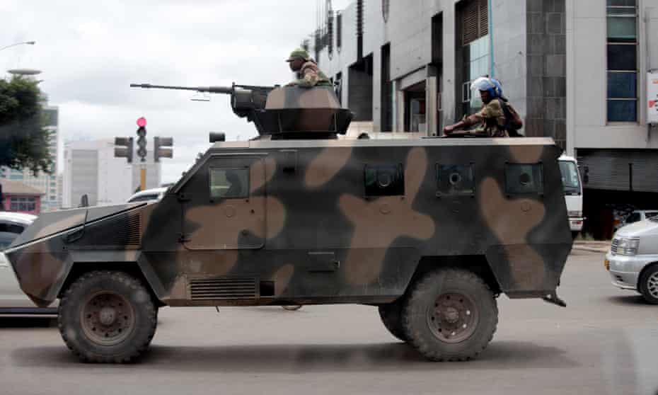 Armed soldiers patrol the Zimbabwean capital Harare on 21 January.