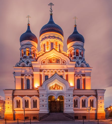 The floodlit, Russian-styled Alexander Nevsky Cathedral, a building in three tiers with domes, spires and arches