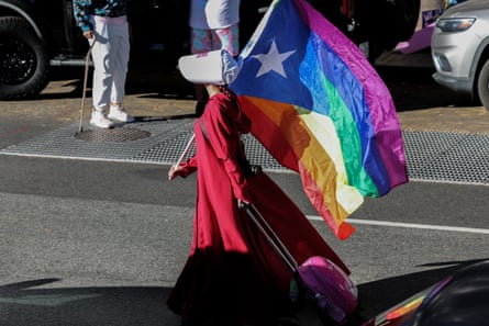 She's also carrying a rainbow flag.