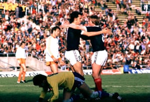 Scotland’s Kenny Dalglish (right) celebrates his equaliser with teammate Joe Jordan.