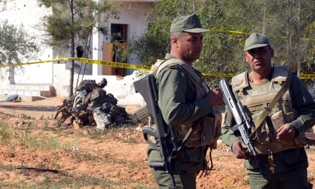Tunisian soldiers stand guard at scene of  attack at Ben Guerdane near Libyan border
