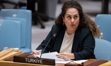 Turkish diplomat Ayse Inanc behind the new Türkiye nameplate at the United Nations.