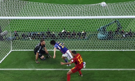Ao Tanaka (17) scores Japan's second goal to leave Spain floored.