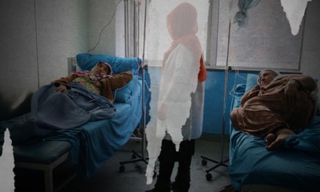 Two patients lie on beds. Health worker stands between them, her image obscured