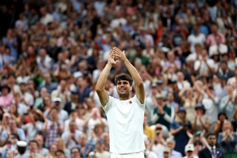Carlos Alcaraz applauds the crowd as he celebrates following his victory against Andrey Rublev.