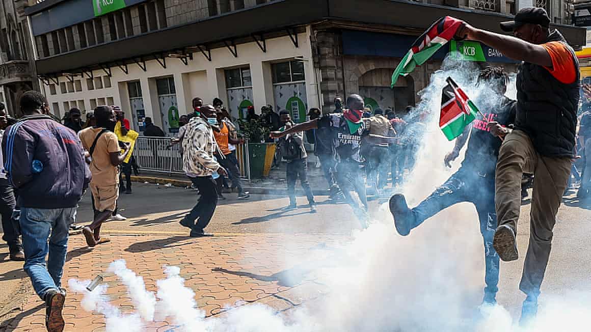 Demonstrators kick teargas canisters in Nairobi