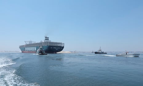 The Ever Given sails through the Suez canal in Ismailia, Egypt.