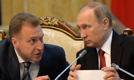 Igor Shuvalov, then deputy prime minister, left, talks to Vladimir Putin during a meeting in 2017.