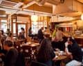 Diners at tables and bar inside Impala restaurant
