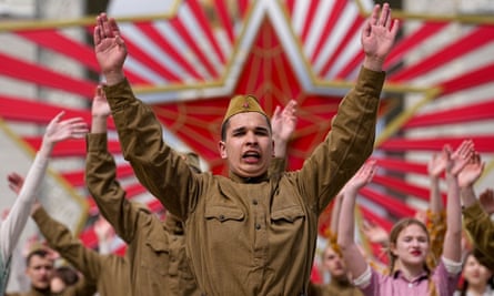 Moscow students dressed in period fashion and Soviet style uniforms perform the Victory Waltz as part of a Victory Day celebration in Moscow.