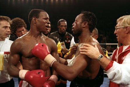 Chris Eubank and Nigel Benn embrace after their WBO middleweight title fight in November 1990.