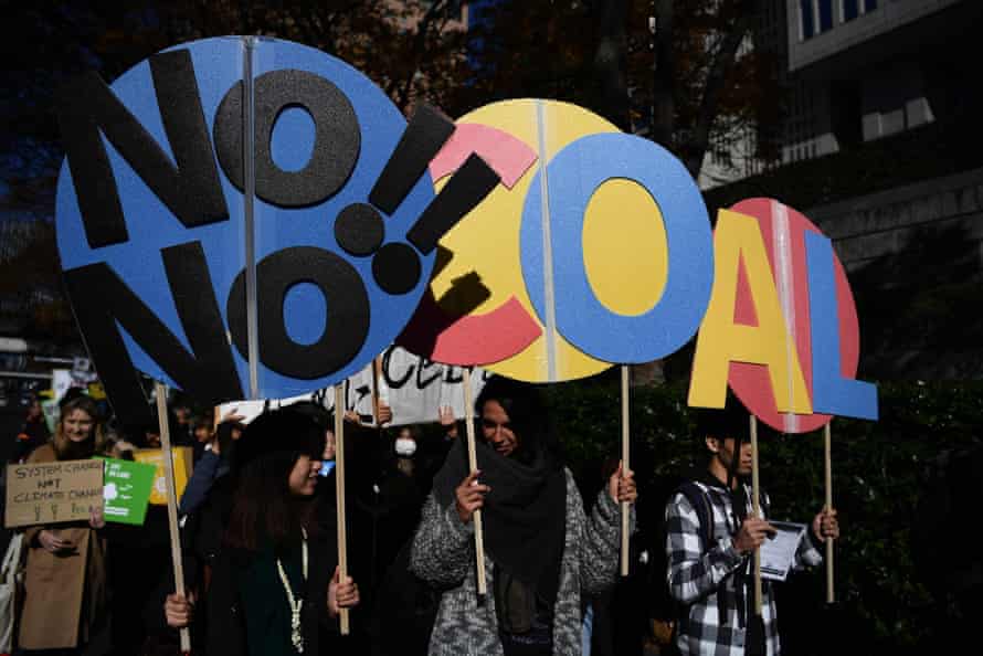 Marchers hold placards saying 'No coal'