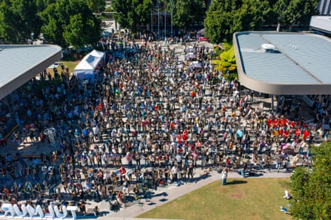 An aerial shot of hundreds of trombonists