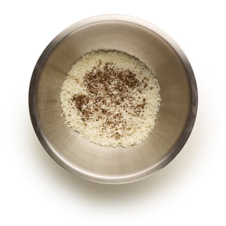 Some grated pecorino and pepper in a bowl.