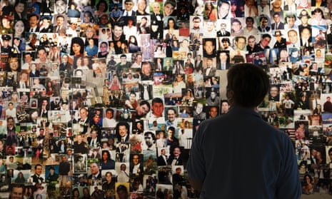 Désirée Bouchat, a survivor of 9/11, looks at photos of those who perished in a display at the 9/11 Tribute Museum on 6 August 2021 in New York City.