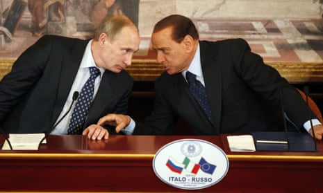 Vladimir Putin (left) confers with then Italian PM Silvio Berclusconi in 2010.