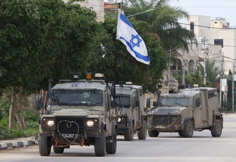 Israeli military vehicles are deployed in the streets during an Israeli raid in the occupied West Bank city of Tulkarm on 17 January.