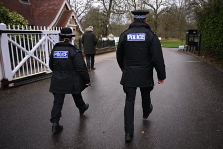 Police officers patrol near Andrew Mountbatten-Windsor's form residence Royal Lodge in Windsor Great Park