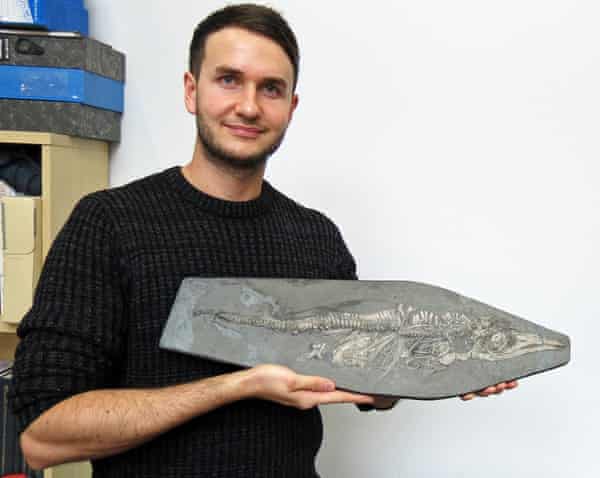 Dean Lomax with the newborn ichthyosaur from the collections of the Lapworth Museum of Geology, University of Birmingham