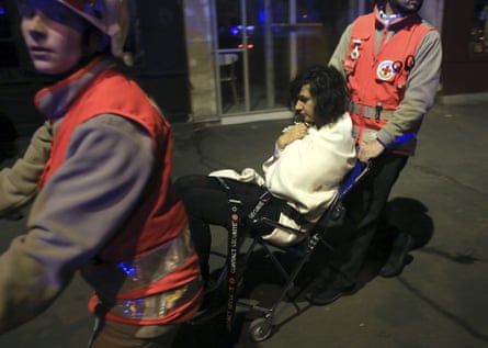 A woman being evacuated from the Bataclan