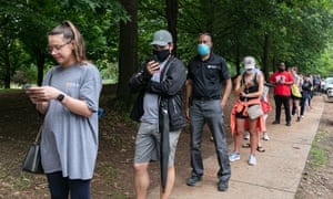 People wait in line to vote in Georgia’s primary election in Atlanta on 9 June.