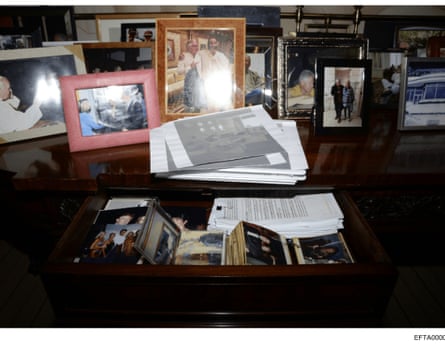 photos on and inside of desk