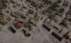 A man digs a grave at the Xico cemetery, as the coronavirus outbreak continues, in Valle de Chalco, Mexico 29 June 2020.