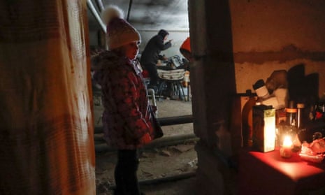 Local residents stay at a bomb shelter during Ukraine-Russia conflict in the besieged southern port city of Mariupol, Ukraine March 20, 2022.