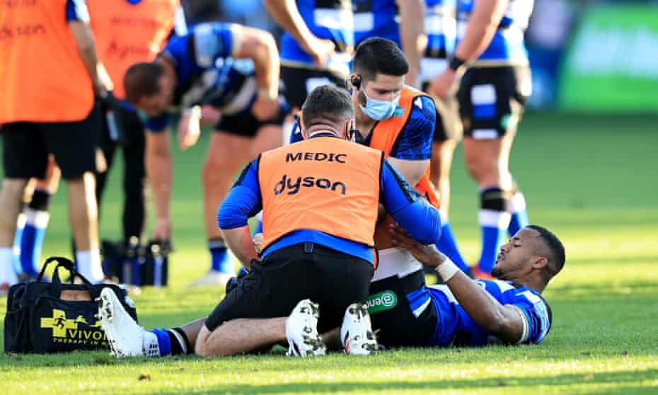 Bath’s Anthony Watson receives attention to a strained knee during the Premiership match against Saracens on Sunday
