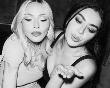 A black and white photo of Madonna pouting and Charli xcx blowing a kiss