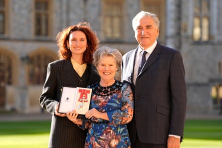 Imelda Staunton with Bessie and Jim Carter after being made a dame at Windsor Castle in 2024.