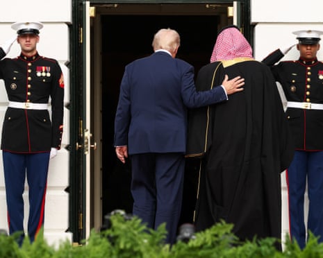 Donald Trump guides Mohammed bin Salman into the White House.
