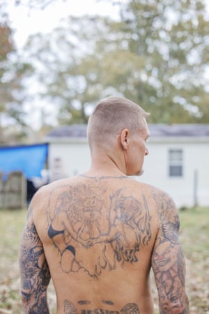 Benny Ivey got the now fading royal shield tattooed on his back about 20 years ago. The angel and devil shaking hands from each side of the shield represent an ex-girlfriend. 4560.jpg?w=300&q=55&auto=format&usm=12&f