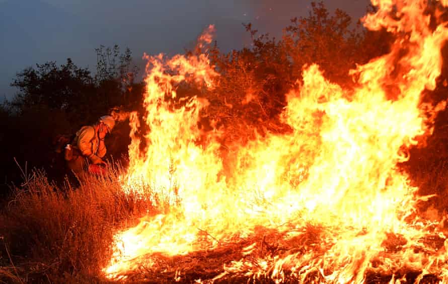 A firefighter sets backfires as the El Dorado fire approaches in Yucaipa on 7 September 2020.