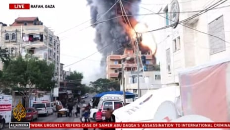 Al Jazeera broadcast captures moment strike hits building in Rafah – video