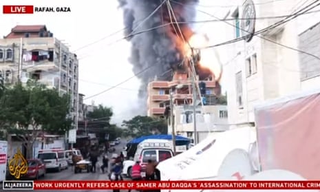 Al Jazeera broadcast captures moment of explosion at Rafah building – video