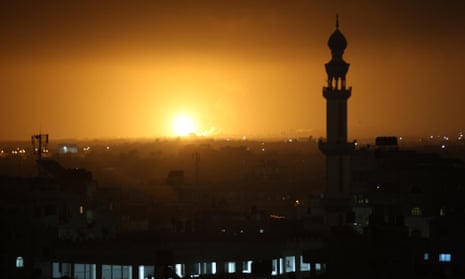 An explosion visible after Israeli air strikes  in the southern Gaza Strip on Tuesday.