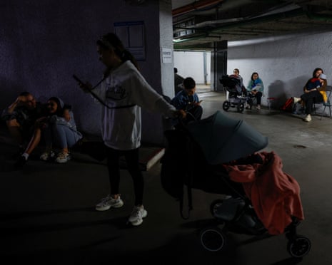 Residents gather in an underground parking lot during the strikes